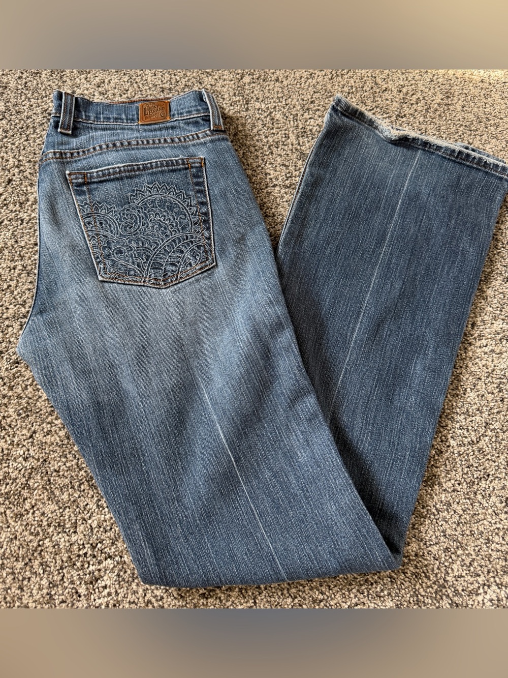 Lucky Brand blue jeans with embroidered paisley design on back pocket, size 6